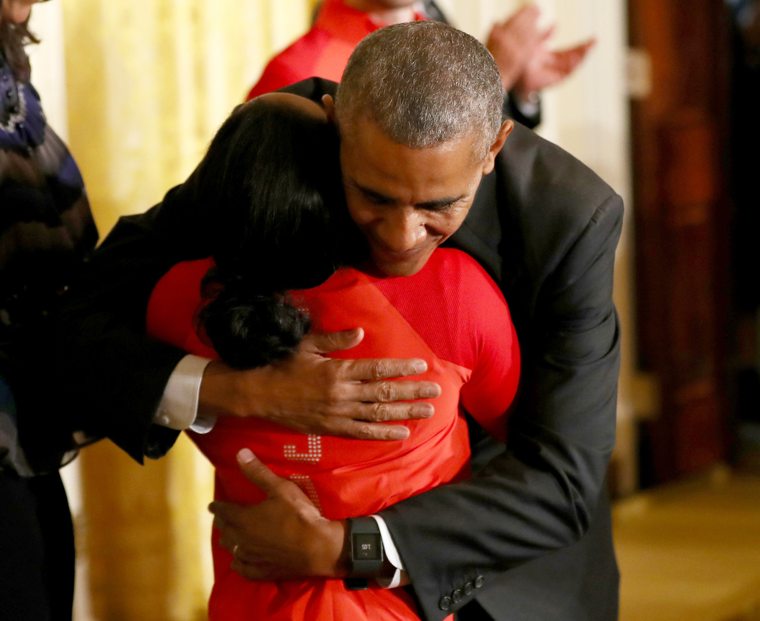 WASHINGTON, DC - SEPTEMBER 29:  U.S. President Barack Obama hugs Olympian Simone Biles during an East Room event at the White House September 29, 2016 in Washington, DC. President Obama and first lady Michelle Obama welcome the 2016 U.S. Olympic and Paralympic teams to the White House to honor their participation and success in the Rio Olympic Games this year.  (Photo by Elsa/Getty Images)