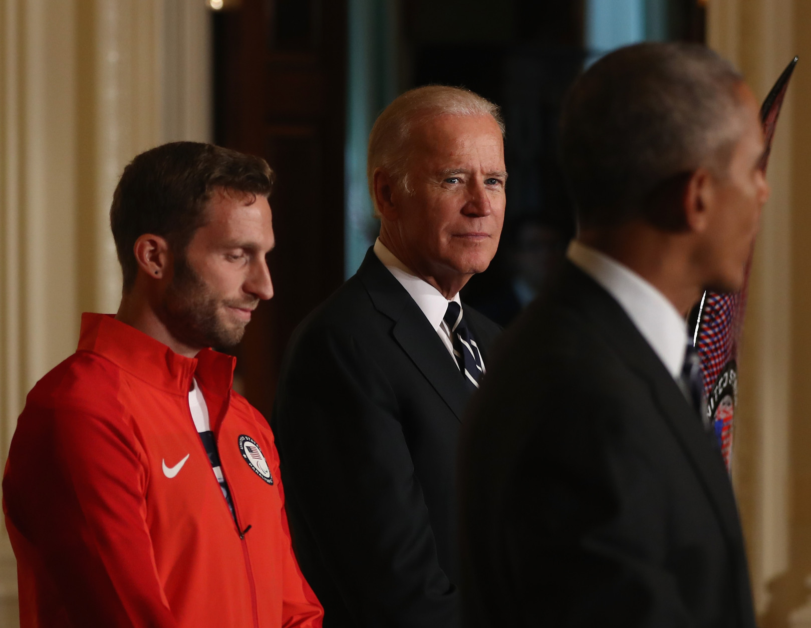 WASHINGTON, DC - SEPTEMBER 29:  U.S. President Barack Obama speaks as Josh Brunais and Vice President Joe Biden stand by during an East Room event at the White House September 29, 2016 in Washington, DC. President Obama and first lady Michelle Obama welcome the 2016 U.S. Olympic and Paralympic teams to the White House to honor their participation and success in the Rio Olympic Games this year.  (Photo by Elsa/Getty Images)