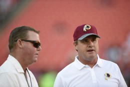 Washington Redskins general manager Scot McCloughan, left, talks with head coach Jay Gruden, right, before an NFL preseason football game against the New York Jets, Friday, Aug. 19, 2016, in Landover, Md. (AP Photo/Nick Wass)