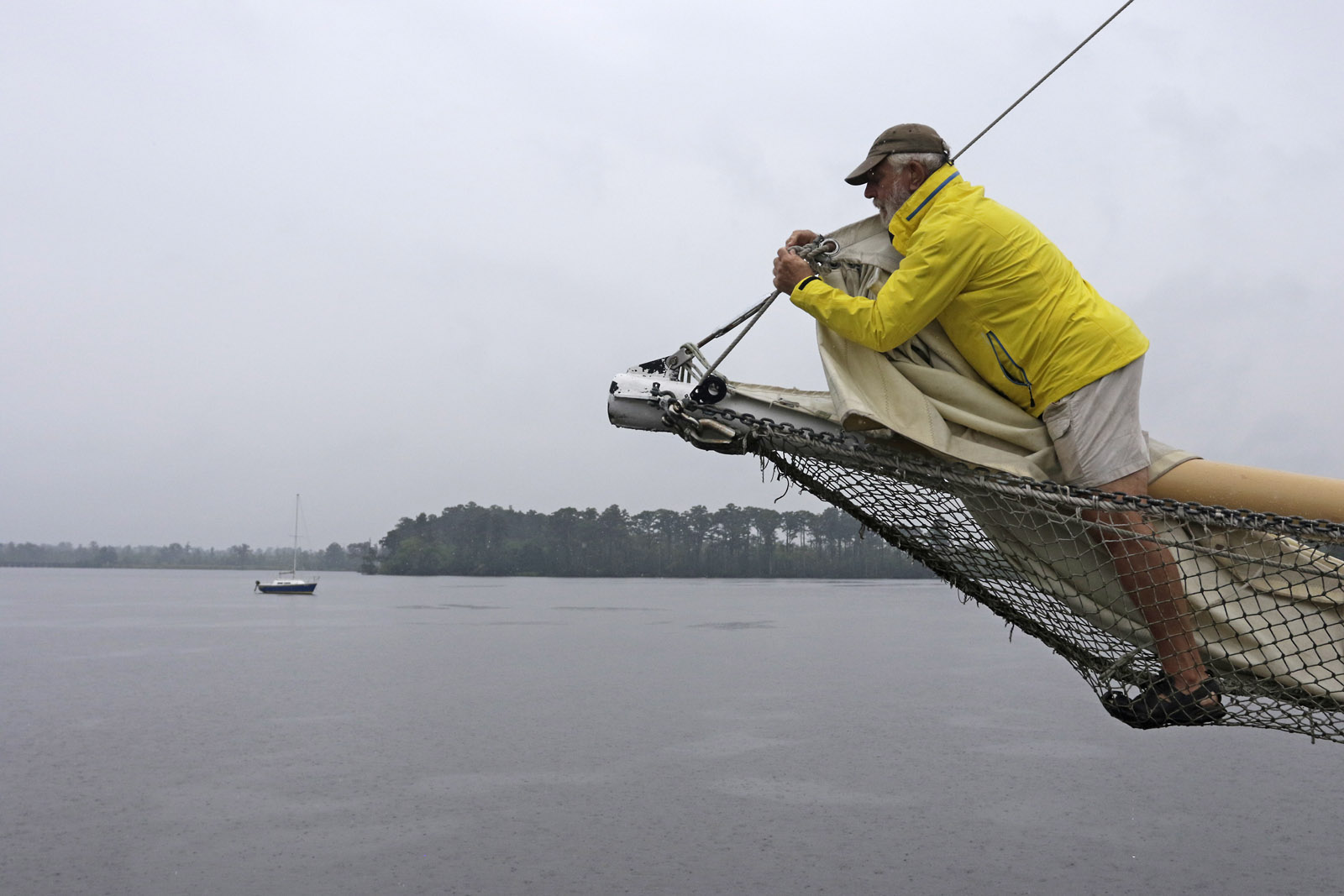 Rick Brass removes the head sail of the Jeanie B Schooner in downtown Washington, N.C., Friday, Sept. 2, 2016 as Tropical Storm Hermine was expected to move into the Carolinas and roll up the East Coast after making landfall in Florida. St. Mary's County could see up to 2 inches of rain by Saturday evening; the D.C. metro area will see less than an inch. (AP Photo/Tom Copeland)