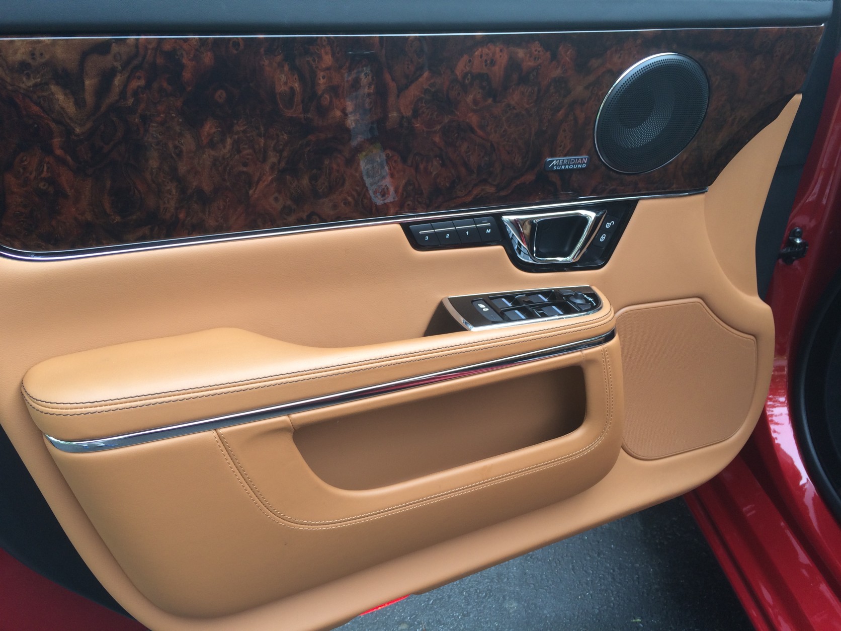 The 2016 Jaguar XJL Portfolio’s interior doesn’t have as much wood as Jaguars in the past, but it's still very British inside, and the smell of wood and leather is intoxicating. (WTOP/Mike Parris)