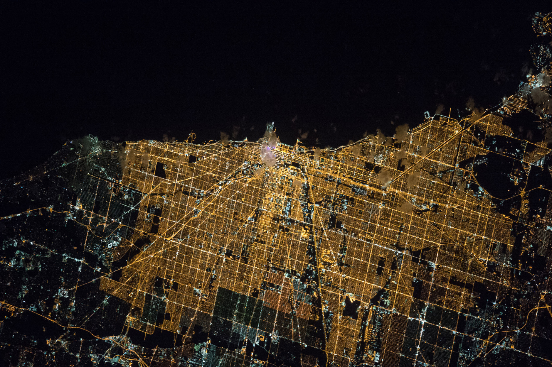 Expedition 47 Commander Tim Kopra of NASA captured this brightly lit night image of the city of Chicago on April 5, 2016, from the International Space Station. Kopra (@astro_tim) wrote, "#Goodnight #Chicago from @Space_Station. #CitiesFromSpace"