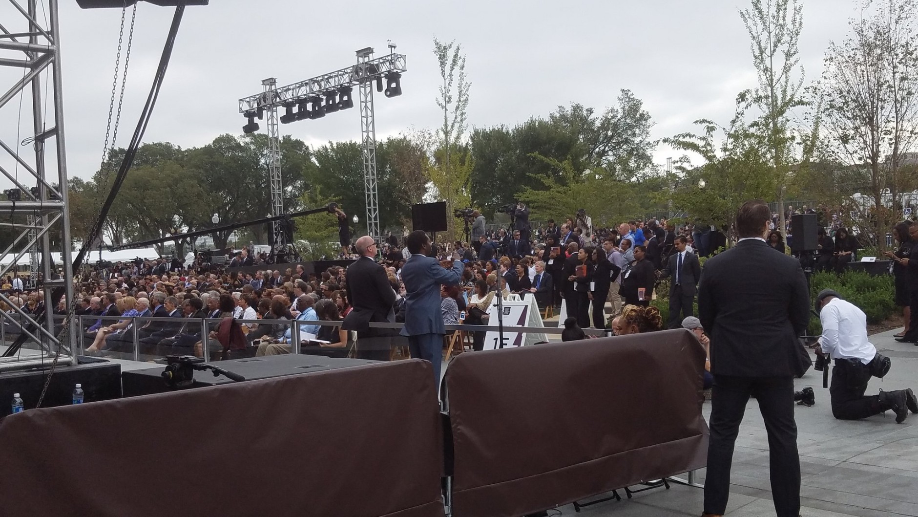 The crowd watches as speakers take the stage at the opening dedication of the National Museum of African American History on Sept. 24, 2016. (WTOP/Allison Keyes)