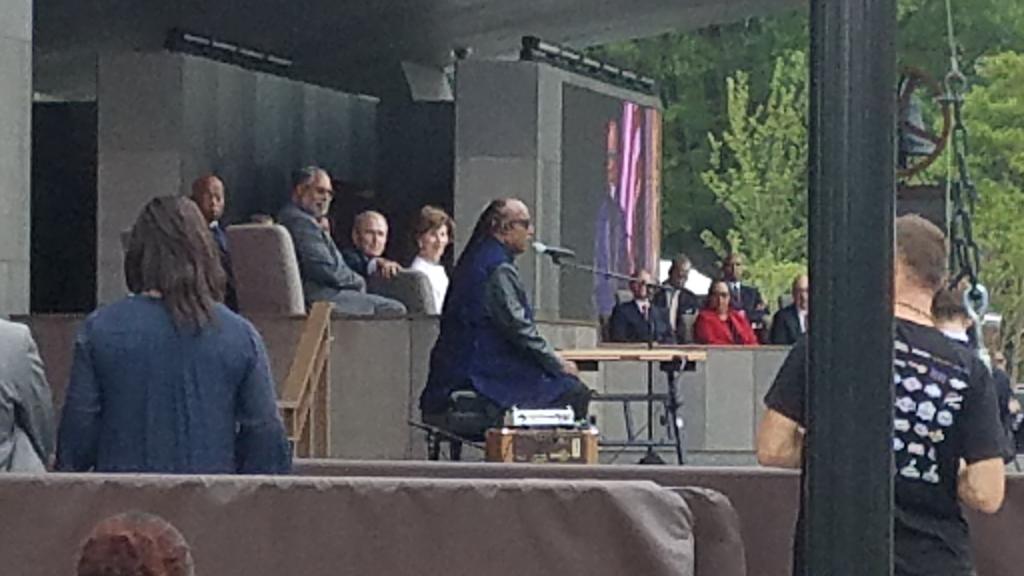 Before performing at the opening dedication ceremony for the National Museum of African American History and Culture, Stevie Wonder tells the crowd, "We can come together." (WTOP/Allison Keyes) 