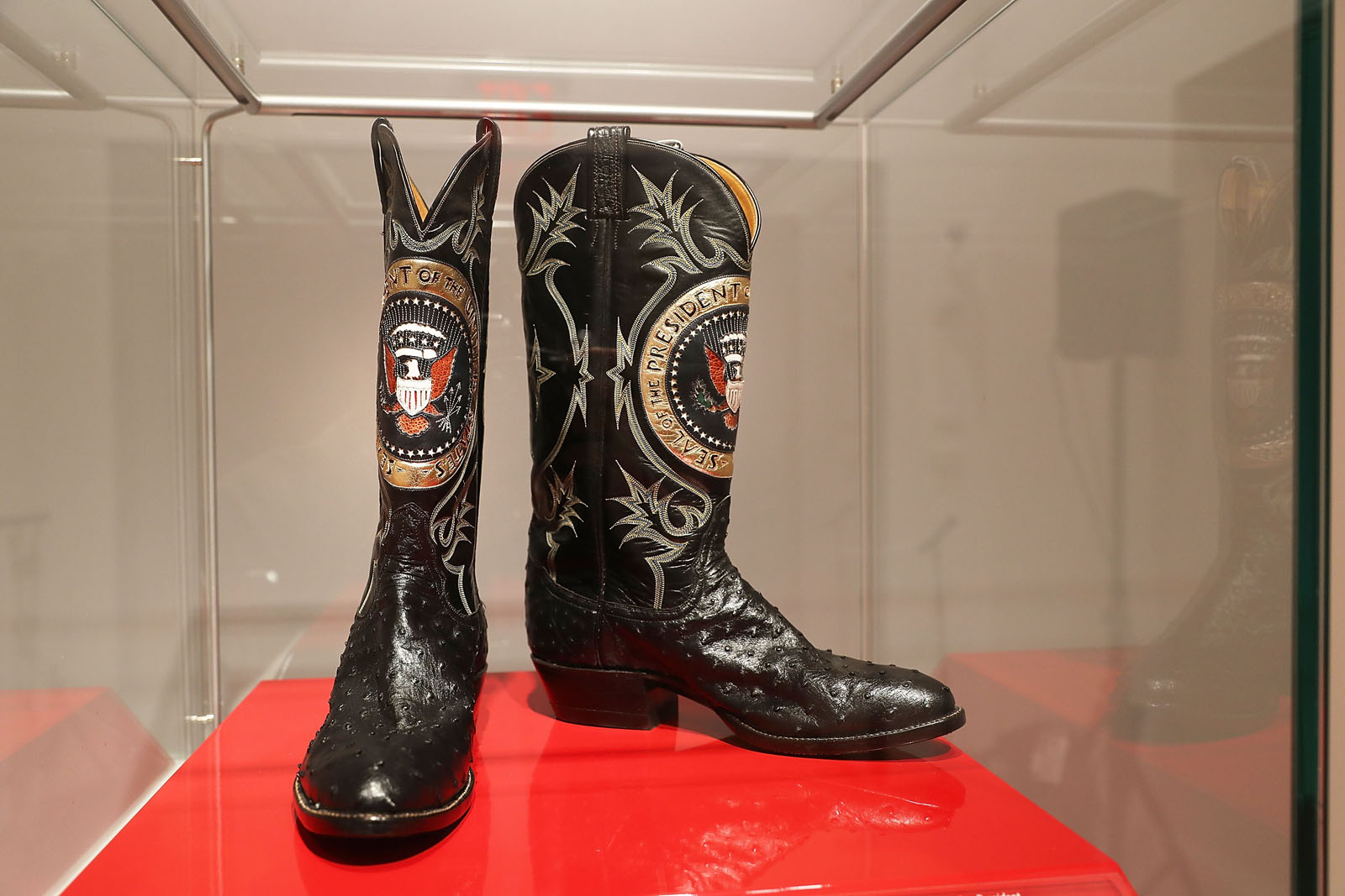 NEW YORK, NY - SEPTEMBER 16:  A pair of 
Ronald Reagan's cowboy boots sit in a case  at Christie's where items from the former president and Nancy Reagan's California home are to be auctioned shortly on September 16, 2016 in New York City. Many personal items of the first couple are to be auctioned including "Hollywood Regency"style furniture and light fixtures, decorative works, handbags, porcelain stamped with the presidential seal, jewelry and a pair of Reagan's cowboy boots with the presidential seal. The e-catalog auction, which is expected to generate more than $2 million with individual items ranging from $1,000 to $50,000, goes live at Christie's Monday in New York. Proceeds from the auction will be donated to the Ronald Reagan Presidential Foundation and Institute.  (Photo by Spencer Platt/Getty Images)