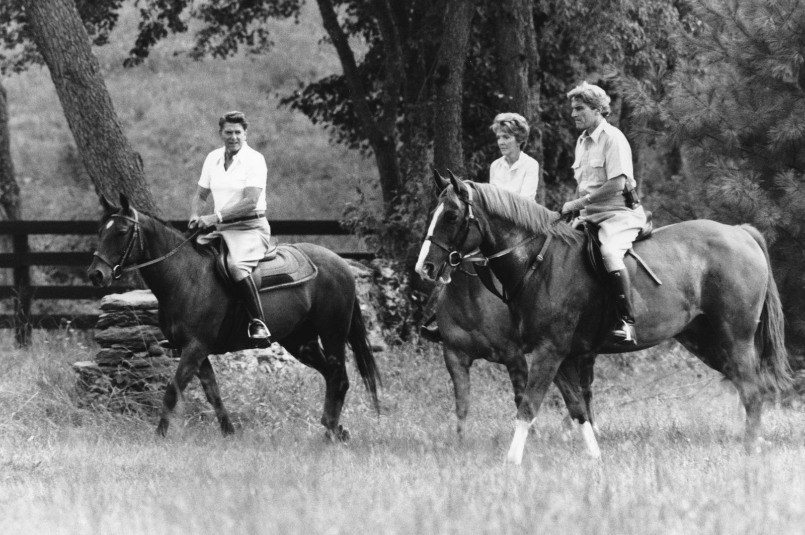 Presidential candidate Ronald Reagan, left, and Nancy Reagan are joined by Sen. John Warner, R-Va., right, in a horseback ride on the grounds of Wexford, a retreat the Reagans are renting near Middleburg, Va.  Warner and wife Elizabeth Taylor live on the neighboring farm.  (AP Photo/Walt Zeboski)