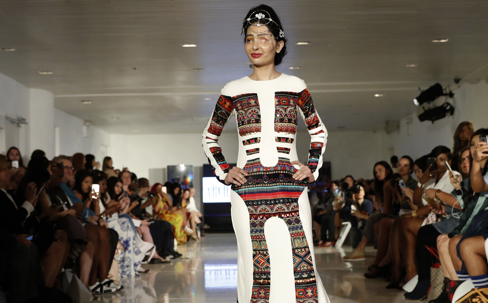 Model and acid attack victim Reshma Querishi models the Archana Kochhar collection during Fashion Week in New York, Thursday, Sept. 8, 2016. (AP Photo/Mary Altaffer)