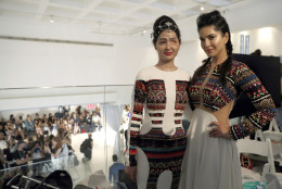 Model and acid attack victim Reshma Querishi, left, and actress Sunny Leone pose for photos backstage after modeling in the Archana Kochhar collection during Fashion Week in New York, Thursday, Sept. 8, 2016. (AP Photo/Mary Altaffer)