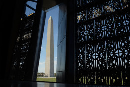 The Washington Monument is framed by a window at the National Museum of African American History and Culture in Washington, Wednesday, Sept. 14, 2016, during a press preview. (AP Photo/Susan Walsh)