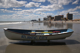 ATLANTIC CITY, NJ - AUGUST 28:  A lifeguard rescue boat sits on the beach in front of the closed Trump Plaza hotel on August 28, 2015 in Atlantic City, New Jersey. After new casinos opened in neighboring states, four of Atlantic City's top casinos closed in 2014, laying-off some 8,000 workers. The closures brought Atlantic City's unemployment rate to more than 11 percent, double the national average. The mass unemployment has produced the highest foreclosure rate of any metropolitan U.S. area, with 1 out of 113 homes now in foreclosure in Atlantic County.  (Photo by John Moore/Getty Images)