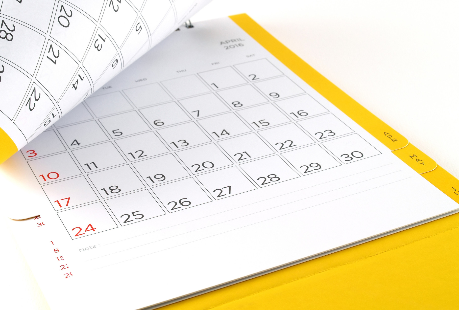 desk calendar with days and dates in April 2016 and blank lines for notes, flip the calendar page