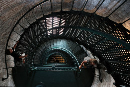 Visitors ascend the steps of the Currituck Beach Lighthouse in Corolla, N.C.,  Sunday, July 14, 2013. The lighthouse, which dates from 1875,  opened to the public in 1990 and attracts thousands of visitors a year.  (AP Photo/Jacqueline Larma)