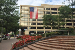 This Rosslyn office building displays the American flag on Friday, Sept. 9, 2016. Twenty-fve buildings in Rosslyn are displaying flags on their exteriors this week to mark the 15th anniversary of the Sept. 11 attacks. The non-annual remembrance started the year after the attacks. Many workers in the area could see smoke from the Pentagon from their office windows. (WTOP/Jeff Clabaugh)