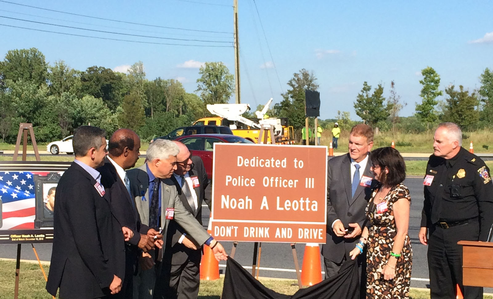 A stretch of Maryland Route 97/Georgia Avenue, near the Intercounty Connector, has been dedicated to the memory of Montgomery County police Officer Noah Leotta who was killed by a drunken driver nine months ago. (WTOP/Dick Uliano)