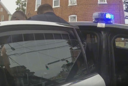 Hagerstown police officers place a 15-year-old girl in a cruiser, before using pepper spray on her. (Courtesy YouTube)
