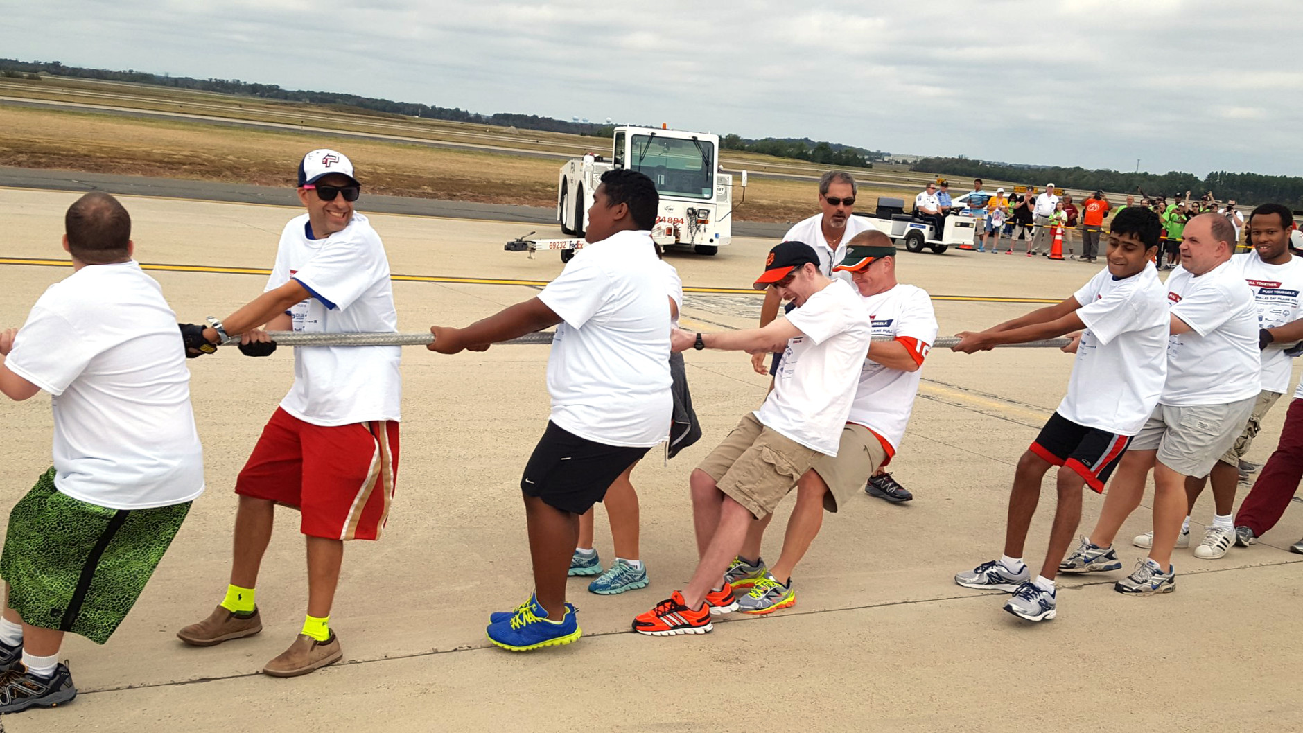 It was all tug, no war, as the Special Olympics team pulls 80 tons of plane 12 feet in just 14 seconds on Saturday, Sept. 17, 2016. (WTOP/Ralph Fox)
