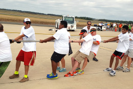 It was all tug, no war, as the Special Olympics team pulls 80 tons of plane 12 feet in just 14 seconds on Saturday, Sept. 17, 2016. (WTOP/Ralph Fox)