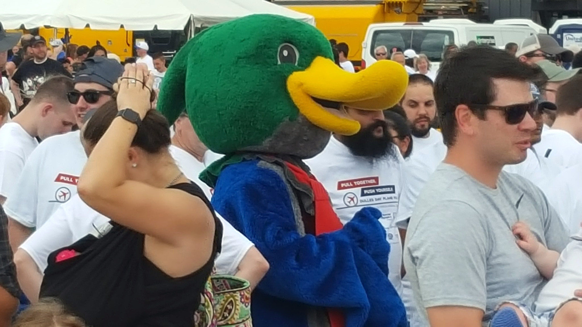 One of several Plane Pull participants -- duck included -- in line at Dulles International Airport on Saturday, Sept. 17, 2016. (WTOP/Ralph Fox)