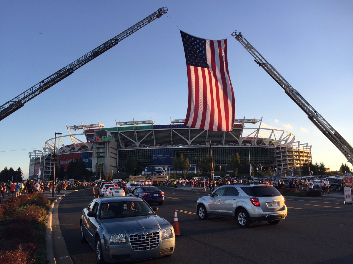 One of the big flags held up by fire trucks outside FedEx Field Monday night. (WTOP/Michelle Basch)