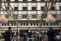 The grand lobby of the Trump International Hotel on Pennsylvania Avenue in D.C. The hotel held a "soft opening" on Sept. 12. The Trump Organization won a 60-year lease from the federal government to transform the Old Post Office building into a hotel. (WTOP photo/Rich Johnson)