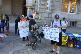 Protesters outside the Trump International Hotel on Pennsylvania Avenue in D.C. The hotel held a "soft opening" on Sept. 12. The Trump Organization won a 60-year lease from the federal government to transform the Old Post Office building into a hotel. (WTOP photo/Rich Johnson)