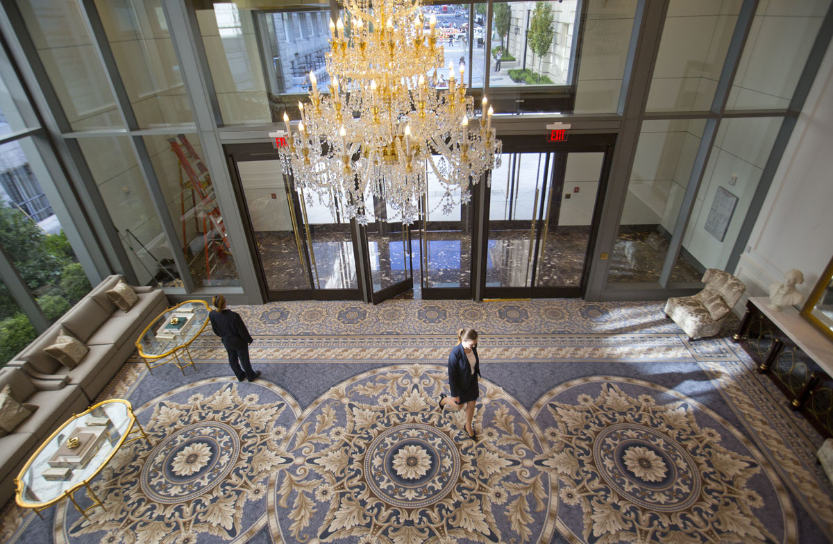 11th street lobby entrance to the Trump International Hotel in downtown Washington, Monday, Sept. 12, 2016 in Washington. The luxury hotel Donald Trump has built in an iconic downtown Washington building is set to open. The Trump International Hotel will begin serving guests Monday. There won't be any fanfare around the opening, which is known as a "soft opening." Grand-opening ceremonies are being planned for October. The Trump Organization won a 60-year lease from the federal government to transform the Old Post Office building on Pennsylvania Avenue into a hotel. (AP Photo/Pablo Martinez Monsivais)