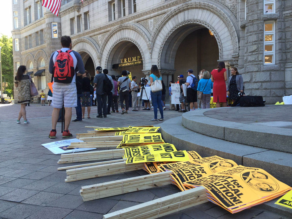 Protesters outside the Trump International Hotel on Pennsylvania Avenue in D.C. The hotel held a "soft opening" on Sept. 12. The Trump Organization won a 60-year lease from the federal government to transform the Old Post Office building into a hotel. (WTOP photo/Rich Johnson)