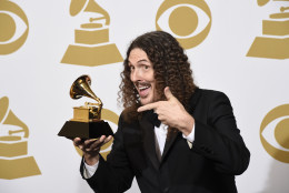 "Weird Al" Yankovic poses in the press room with the award for best comedy album for "Mandatory Fun" at the 57th annual Grammy Awards at the Staples Center on Sunday, Feb. 8, 2015, in Los Angeles. (Photo by Chris Pizzello/Invision/AP)