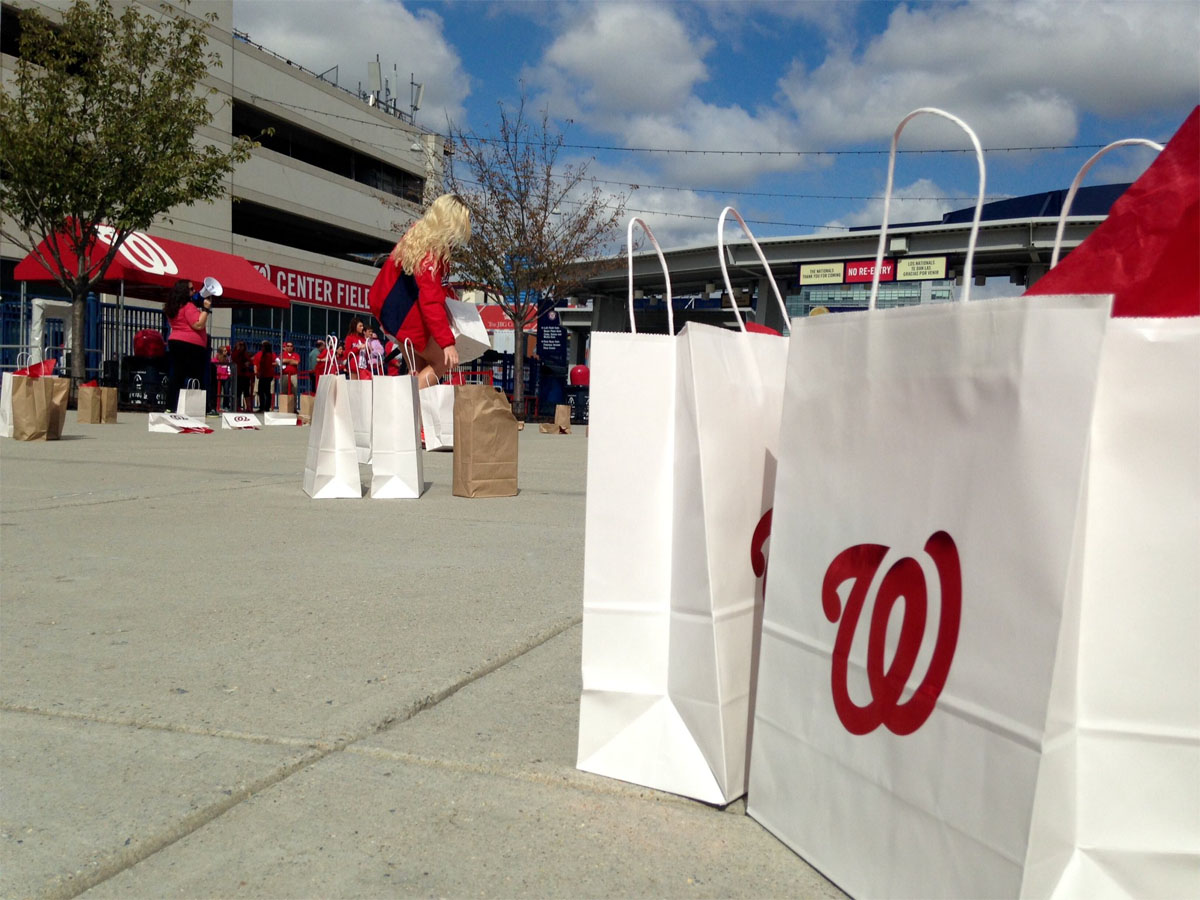 After turning in their lucky charms, fans got 10 seconds to grab a prize bag. Eleven bags contained a pair of tickets to both weekend playoff games (WTOP/Megan Cloherty)