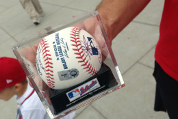 Dad Jeremy Prohaska walked away with the team autographed baseball. (WTOP/Megan Cloherty)