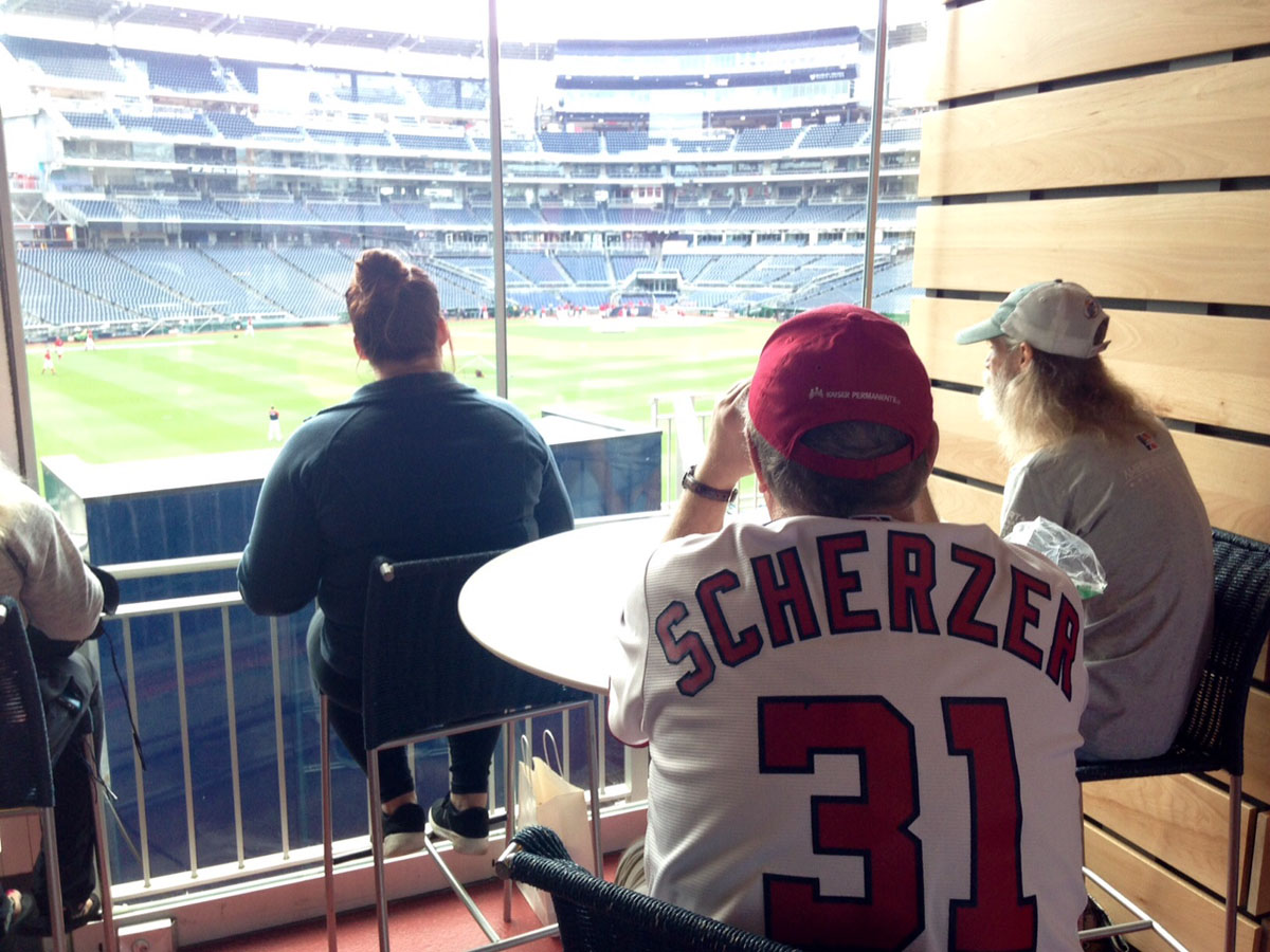 After grabbing a prize, fans were able to watch the team practice from the Budweiser brewhouse. (WTOP/Megan Cloherty)
