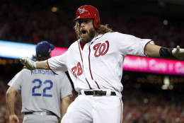 Washington Nationals' Jayson Werth celebrates after scoring off a single by Anthony Rendon, with Los Angeles Dodgers starting pitcher Clayton Kershaw (22) looking on during the third inning of Game 1 of baseball's National League Division Series at Nationals Park, Friday, Oct. 7, 2016, in Washington. (AP Photo/Alex Brandon)