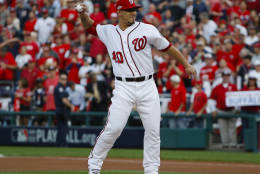 Washington Nationals' Wilson Ramos throws out the ceremonial first ball before Game 1 against the Los Angeles Dodgers in a baseball National League Division Series at Nationals Park, Friday, Oct. 7, 2016, in Washington. (AP Photo/Pablo Martinez Monsivais)