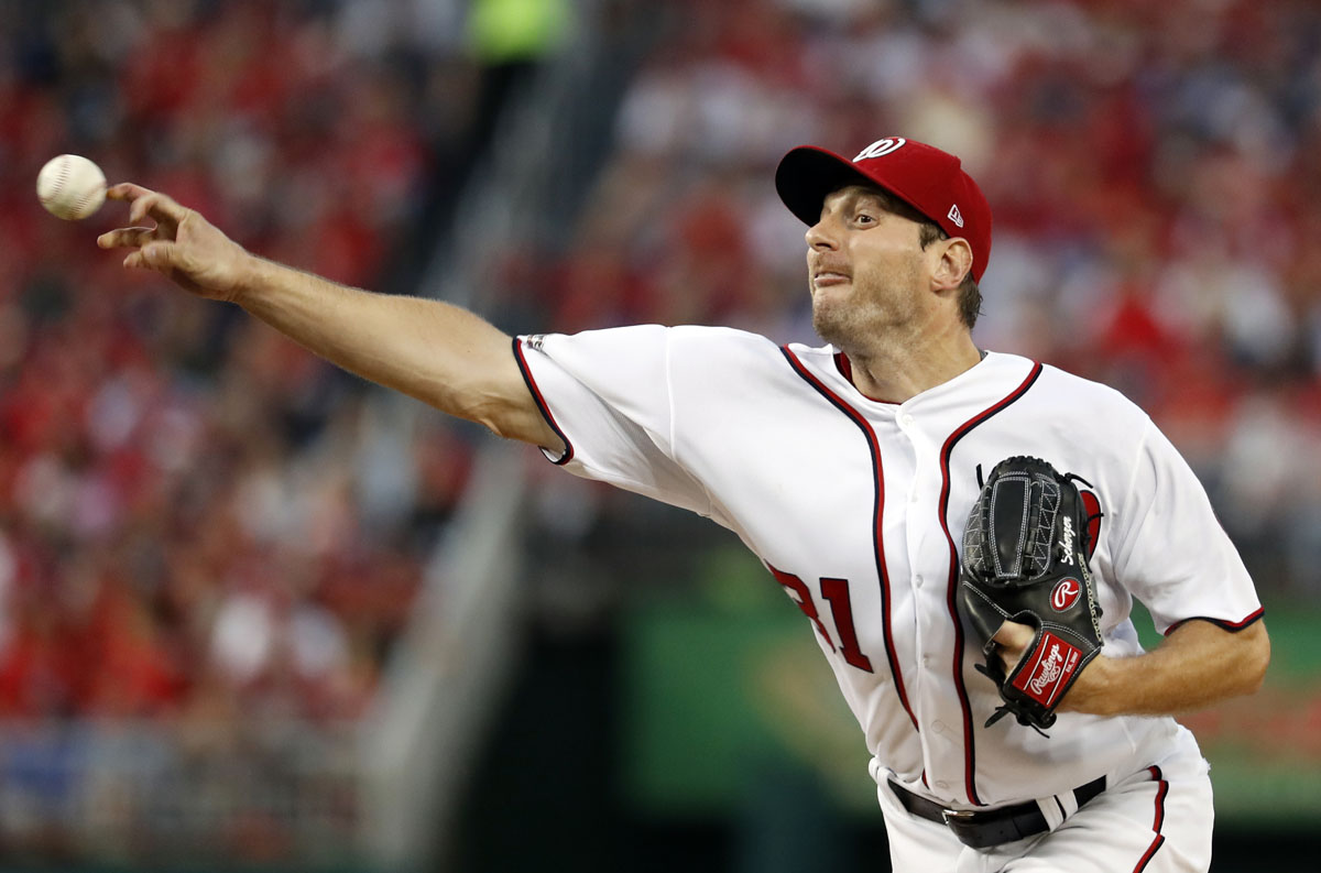 Washington Nationals starting pitcher Max Scherzer throws during the third inning of Game 1 of baseball's National League Division Series against the Los Angeles Dodgers at Nationals Park, Friday, Oct. 7, 2016, in Washington. (AP Photo/Alex Brandon)