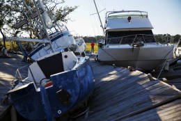 Boats sit pushed up amongst the twisted docks at Palmetto Bay Marina damaged by Hurricane Matthew in Hilton Head, S.C., Sunday, Oct. 9, 2016. (AP Photo/David Goldman)