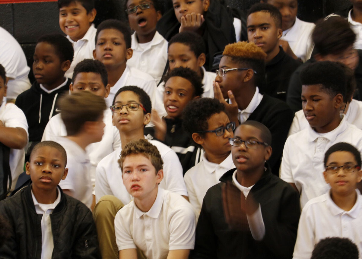 Students at Stephen Decatur Middle School listen during Men Make a Difference Day. (WTOP/Kate Ryan)