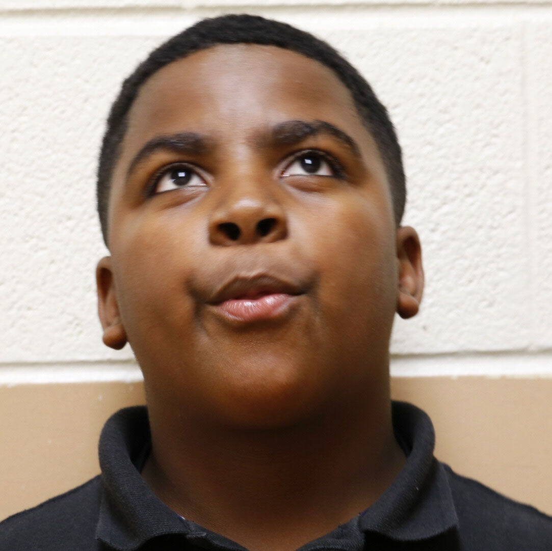 Fourteen-year-old Antonio Sitton considers what makes some kids make good choices and why some make poor choices. A big part of success is "persevering," he says. "You've got to push through." (WTOP/Kate Ryan)