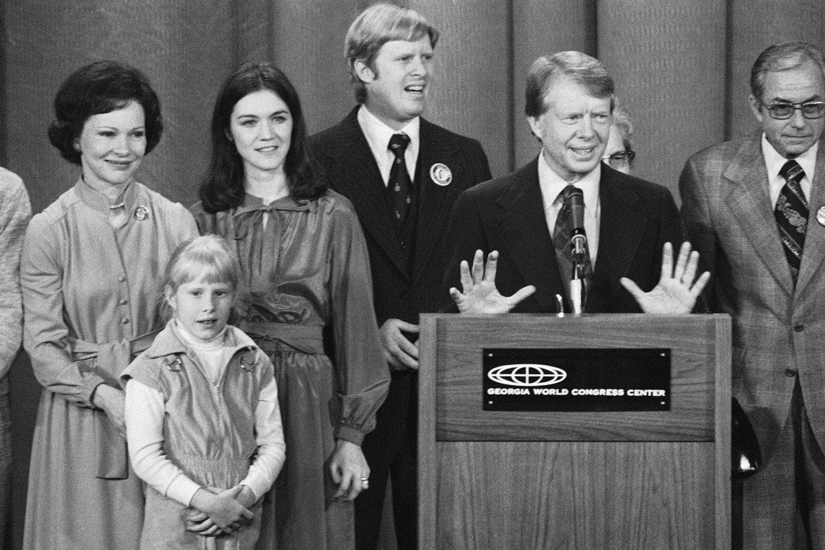 President elect Jimmy Carter says &quot;thanks&quot; to supporters at the World Congress Center on Wednesday, Nov. 3, 1976 in Atlanta, Ga., after defeating General Ford in the election. At left is wife Rosalynn Carter with daughter Amy. (AP Photo)