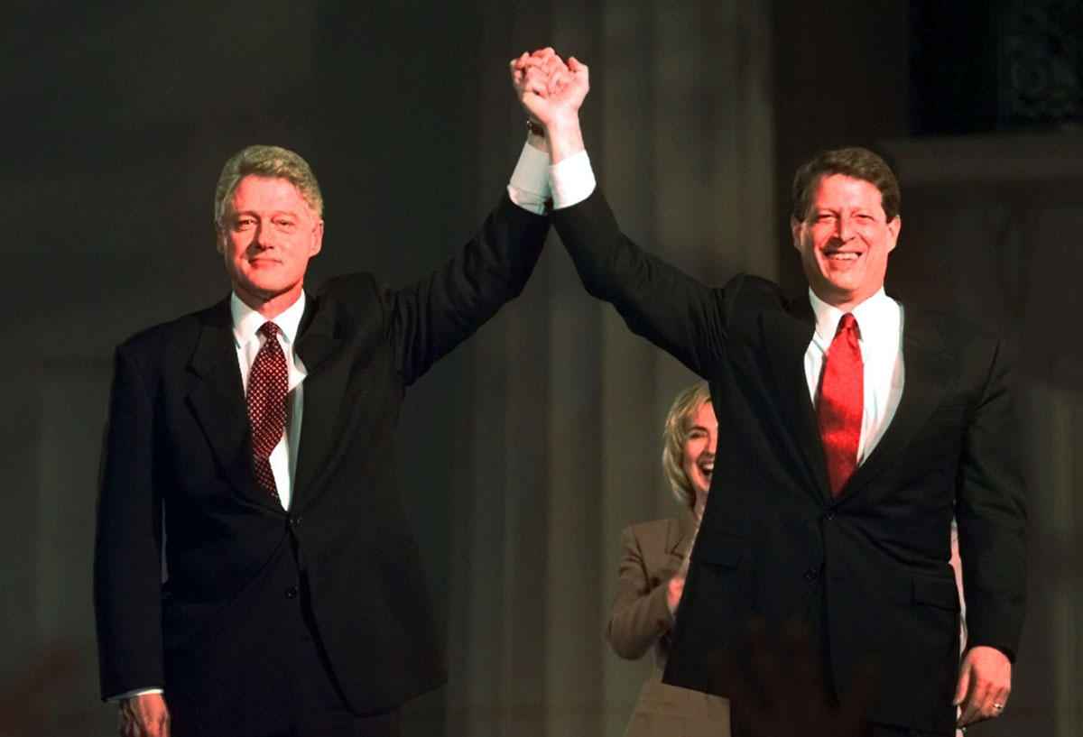 President Clinton and Vice President Al Gore raise their hands in front of the Old State House during an election night celebration in Little Rock, Ark., Tuesday, Nov. 5, 1996. (AP Photo/David Longstreath)