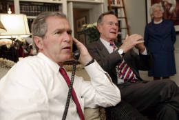Republican presidential candidate Texas Gov. George W. Bush, left, along with his parents George Bush and Barbara watch election returns Tuesday evening, Nov. 7, 2000, in Austin, Texas. (AP Photo/Eric Draper)