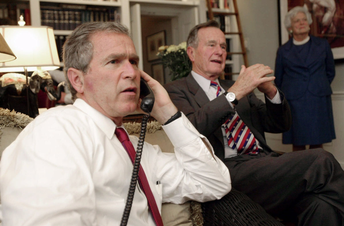 Republican presidential candidate Texas Gov. George W. Bush, left, along with his parents George Bush and Barbara watch election returns Tuesday evening, Nov. 7, 2000, in Austin, Texas. (AP Photo/Eric Draper)