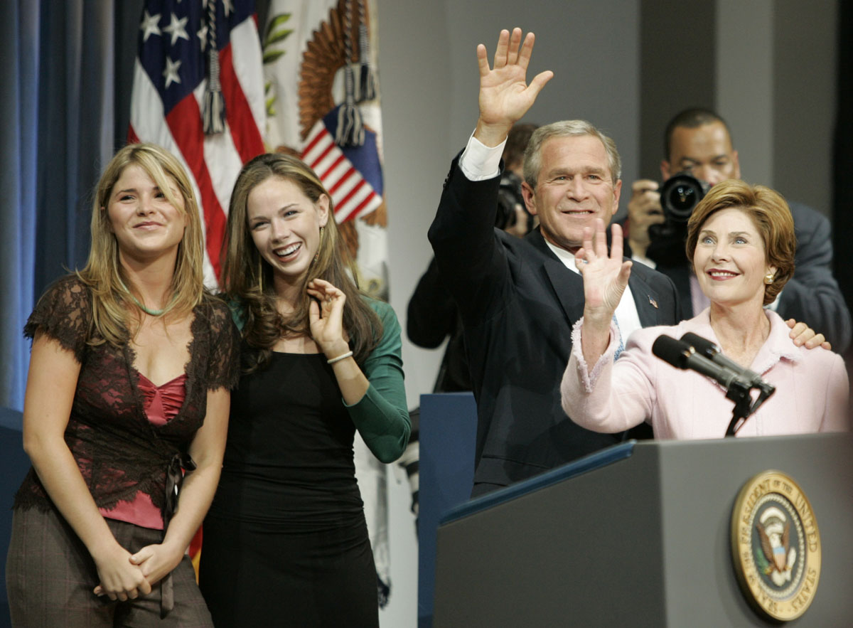 President Bush and first lady Laura Bush wave to supporters at an election victory rally Wednesday, Nov. 3, 2004, at the Ronald Reagan Building and International Trade Center in Washington, as daughters Jenna, left, and Barbara smile. (AP Photo/J. Scott Applewhite)
