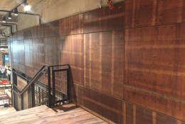 Wood covering part of the walls is the old basketball court that Harlem Globetrotters played on. (WTOP/Michelle Basch)