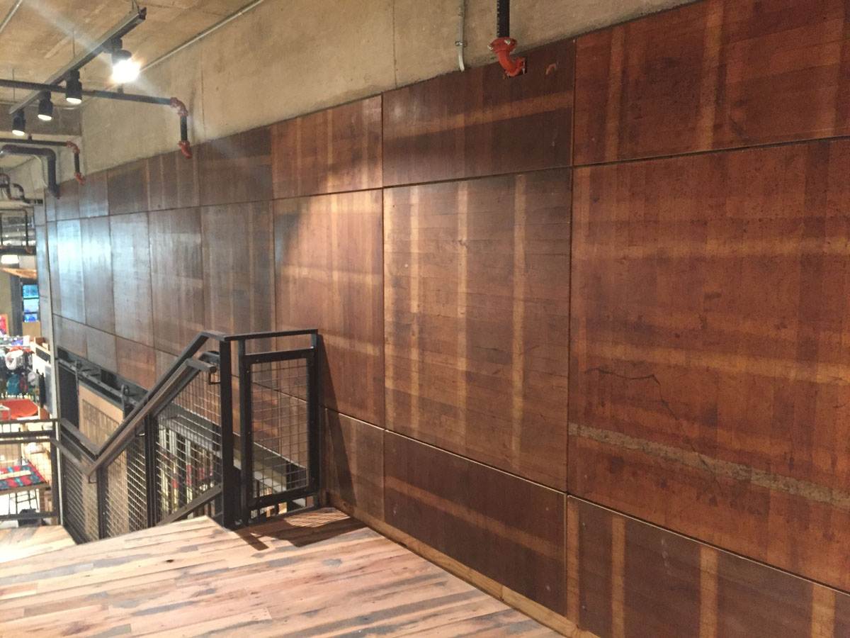 Wood covering part of the walls is the old basketball court that Harlem Globetrotters played on. (WTOP/Michelle Basch)