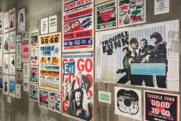 Reproduction posters from some of the concerts held in the buidling have been put up on walls and wrapped around columns. (WTOP/Michelle Basch)
