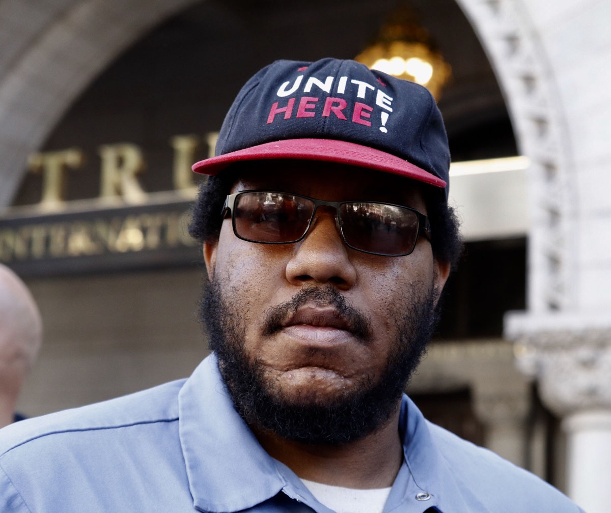 Josh Armstead is a dining hall worker at Georgetown University.  He's a union member and says he was protesting in support of Trump hotel workers in Las Vegas. The employees at Trump's Las Vegas hotel won the right to unionize, but say Trump's refused to come to the bargaining table, so Unite HERE a labor group representing hotel and hospitality workers, was out in front of the Trump International Hotel in Washington DC urging a boycott of the new DC hotel. "We demand respect! And that's why I'm out here. I got my respect at my job when we won the union. I have rights. The workers in Las Vegas, they don't have rights. They need for Donald Trump to actually sit down. If he wants to make America great again he needs to start there!" (WTOP/Kate Ryan)