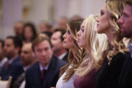 Melania Trump, center, left, listens as her husband, Republican presidential candidate Donald Trump, speaks during the grand opening of the Trump International Hotel- Old Post Office, Wednesday, Oct. 26, 2016, in Washington. (AP Photo/ Evan Vucci)