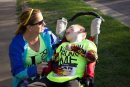 When Kareen Lawson’s feet hit the pavement at this year’s Marine Corps Marathon, she won’t just be powering herself through the 26.2 mile race. She will also be pushing her favorite 10-year-old buddy, Jeffrey Bergeman, in his running chair. “He obviously cannot run for himself, so I have the honor of being his legs,” she said. They are pictured here at their first race in Wisconsin, where the Bergeman family lives. (Courtesy Michael Ojibway)