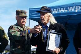 World War II veteran Chilton “Chilly” Raiford, 93, received a Navy citation and was recognized for his service and bravery during a ceremony in Mannasas Va. on Saturday, Oct. 29, 2016. (WTOP/Kathy Stewart)