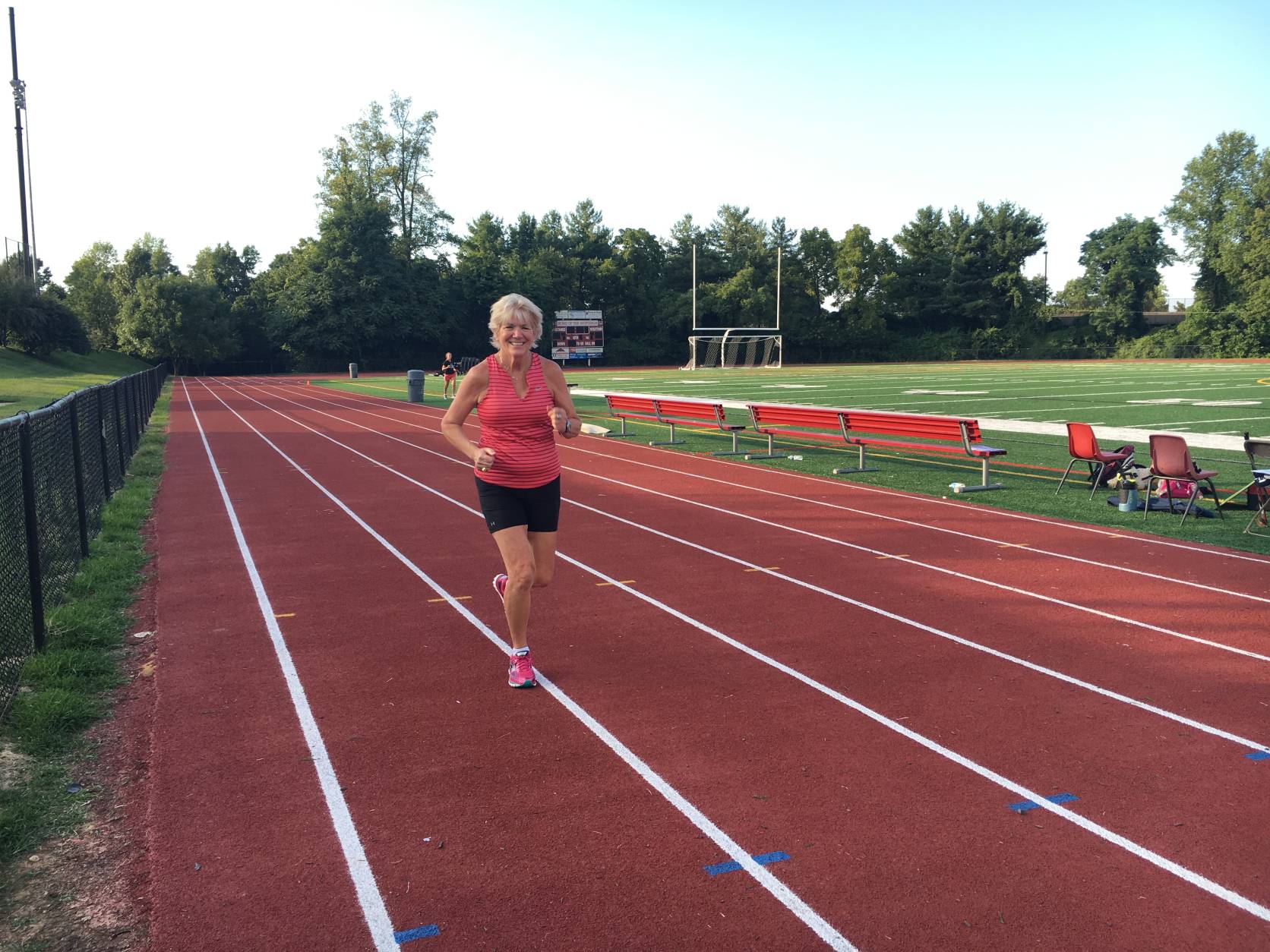 Roxanne trains for the Marine Corps Marathon on the track at George Mason High School, trying to finally fulfill her son’s dream of finishing the MCM with a fast enough time to qualify for the Boston Marathon. “That definitely would be on the wings of Jeff,” she said. (Courtesy Roxanne Kaylor) 